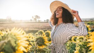 Female Model in Sun Hat in a sun flower field