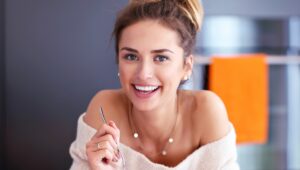 Young Woman Model Smiling after Rhinoplasty